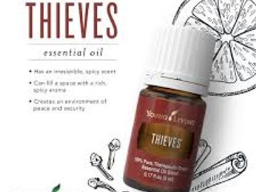 Thieves essential oil bottle with spice illustrations and health benefits listed.