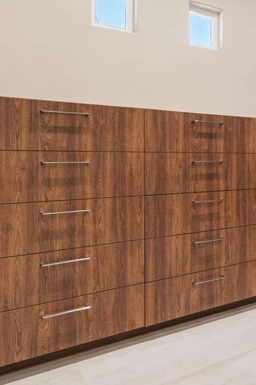 Custom cabinets made for modern closet design with English Walnut panels by American Laminate