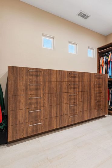 Custom cabinets made for modern closet design with English Walnut panels by American Laminate