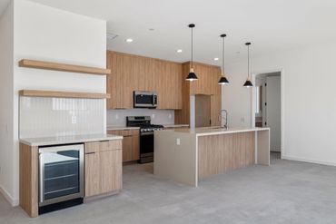 Olmo Miele by Salt used for custom cabinets in modern kitchen design for beautiful Yucca Valley home