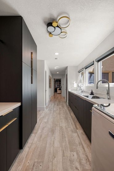 Beautiful home design with integrated floating custom cabinets finished in Black Woodgrain by Egger