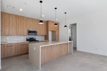 Olmo Miele by Salt used for custom cabinets in modern kitchen design for beautiful Yucca Valley home