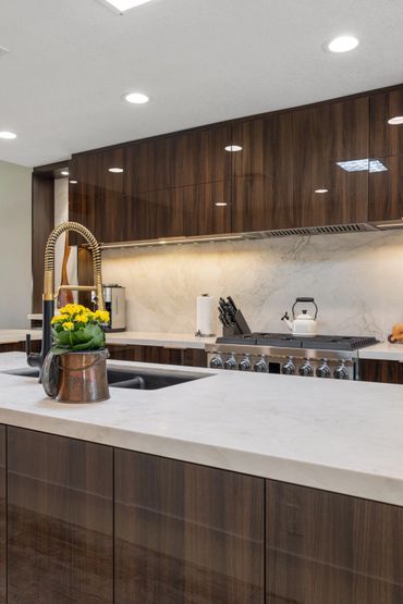 Modern kitchen design with integrated custom cabinets in Olmo Gloss, the Luxe Collection by Alvic