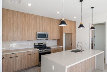 Olmo Miele by Salt used for custom cabinets in modern kitchen design for beautiful Yucca Valley home