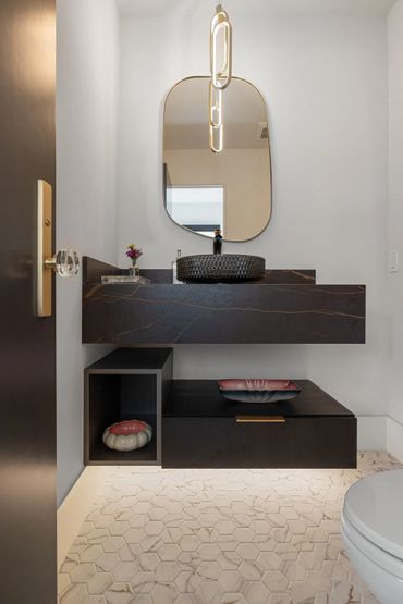 Beautiful home design with integrated floating custom cabinets finished in Black Woodgrain by Egger