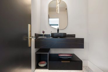 Beautiful home design with integrated floating custom cabinets finished in Black Woodgrain by Egger