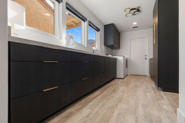 Beautiful home design with integrated floating custom cabinets finished in Black Woodgrain by Egger
