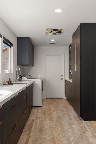 Beautiful home design with integrated floating custom cabinets finished in Black Woodgrain by Egger