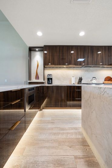Modern kitchen design with integrated custom cabinets in Olmo Gloss, the Luxe Collection by Alvic
