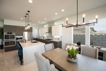 Modern kitchen design with integrated custom cabinets clad in Matte Dark Gray by Mirlux panels.
