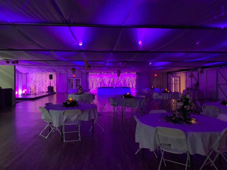 Evening setting with amazing lighting showing mostly purple in this picture. Table Linens available.