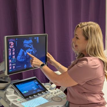 Dawn pointing at an ultrasound image of the baby's mouth