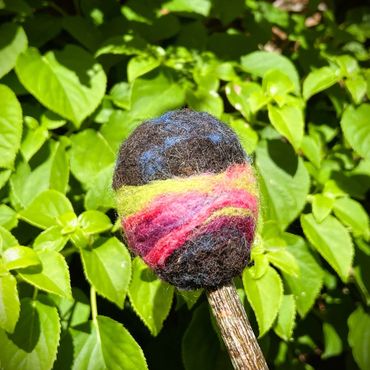 Swirling green, purple and green felted wool on a beater head