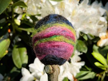 Swirling green, purple and green felted wool on a beater head