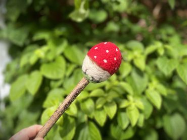 Image of the Fly Agaric inspired beater. A red capped mushroom with white spots on a birch beater