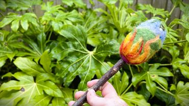 Beltane beater showing flaming earth design.