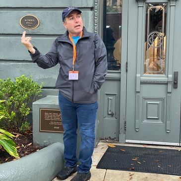 JP, co-founder and tour guide of Bull Run Walking Tours in Savannah, Georgia, sharing historic stories in front of a landmark home in the city’s Historic District
