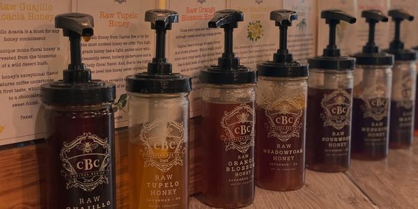 photo of honey jar samples on counter