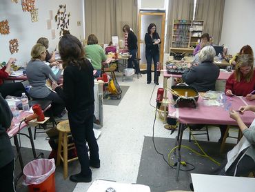 students working independently during an encaustic workshop