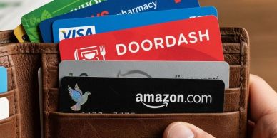 Wallet with various cards including Visa, DoorDash, and Amazon.