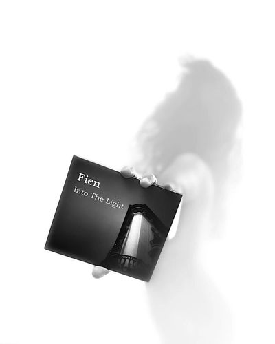 Photo of Fien holding newly released CD for her EP "Into The Light"