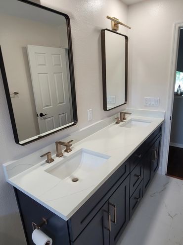 Custom bathroom vanity with quartz top and matte black fixtures