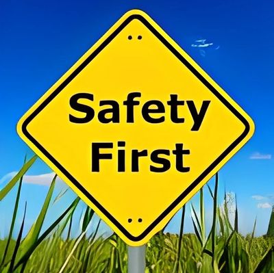 Yellow diamond sign saying 'Safety First'.