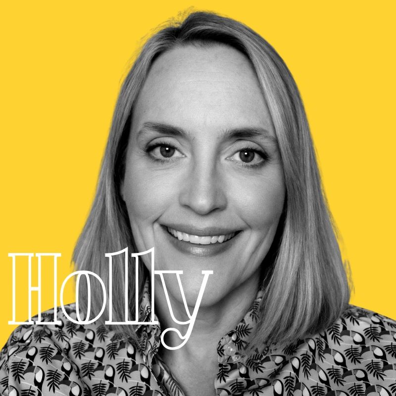 Portrait of a smiling woman named Holly against a yellow background.