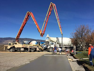 Pumping concrete for new basketball court construction