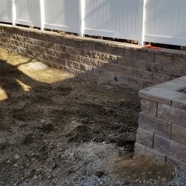 New Retaining wall with vinyl fencing addition for privacy