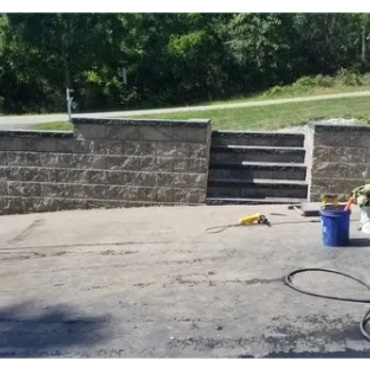 Newly installed block retaining wall adds functionality and appearance