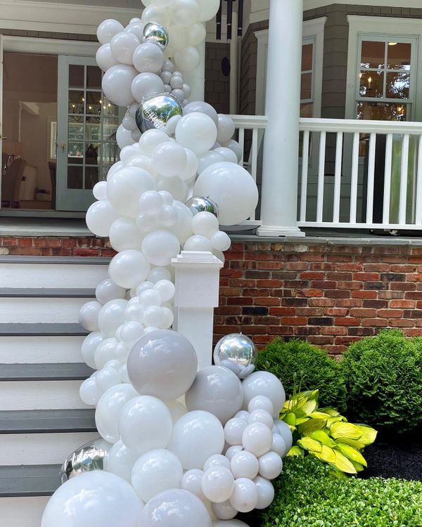 White Organic Balloon Garland on railing