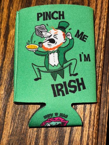 Green can cooler with a cartoon Irish character and text.