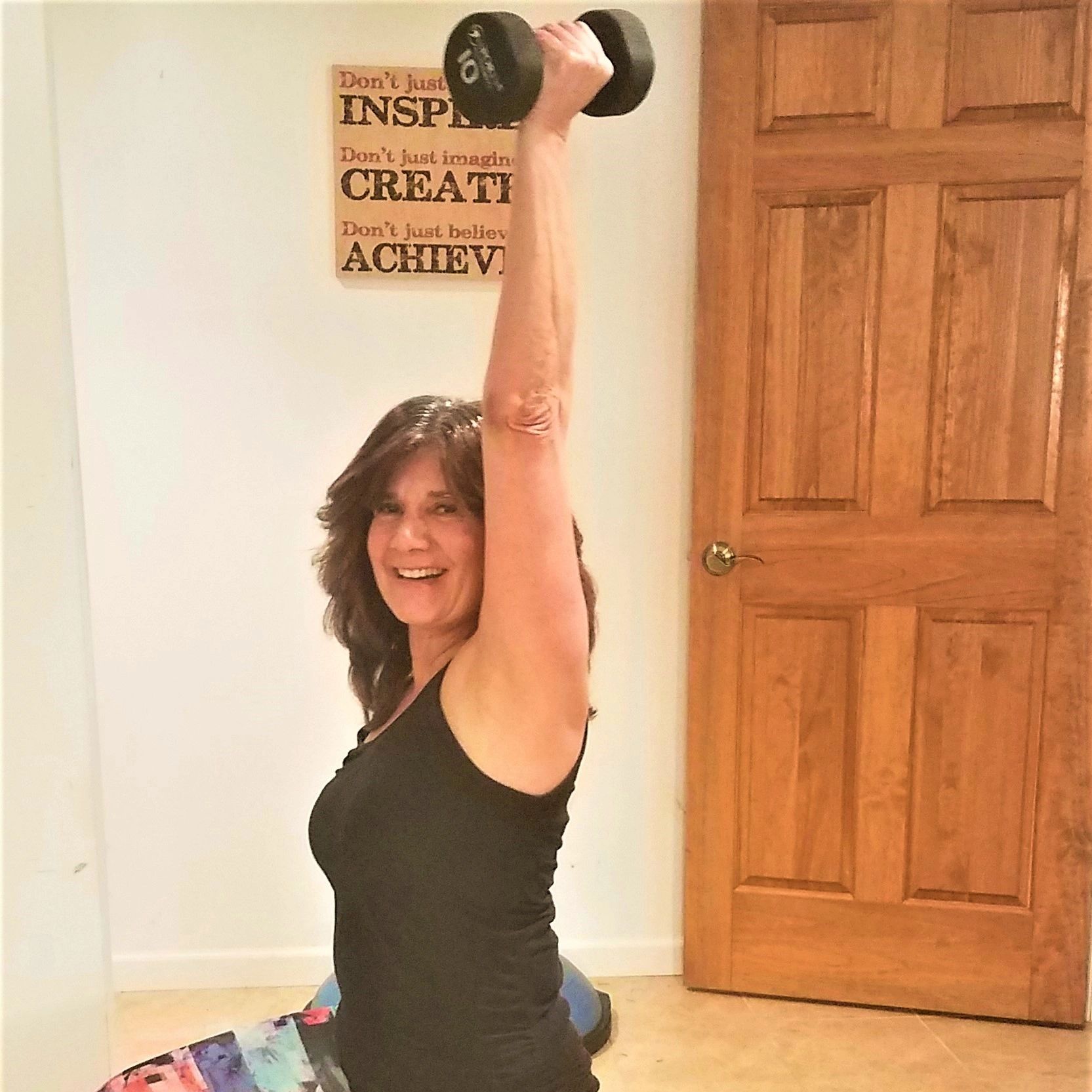 Personal Trainer Cathy Florakis performing a Lunge and Overhead Press