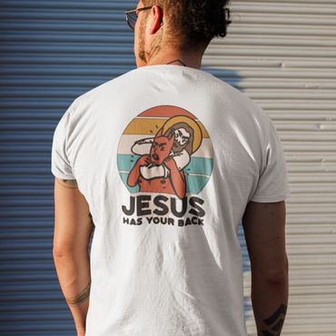 Man wearing a white t-shirt with a graphic of Jesus holding a devil mask and text.