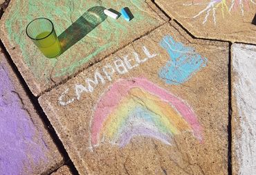 chalk drawing of rainbow and Campbell's Trust logo