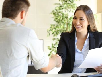 Lady in coat just closed a deal with a businessman