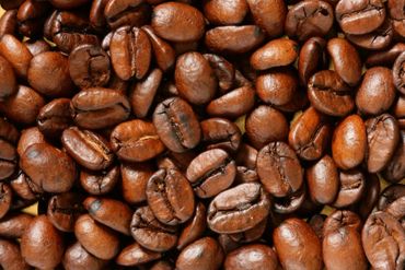Close-up of roasted coffee beans with rich brown texture.