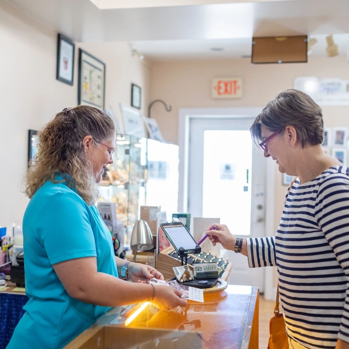 making a purchase at Sand N Stones