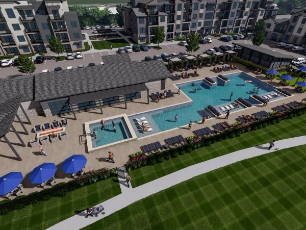 Modern apartment complex with swimming pool and lounge area.