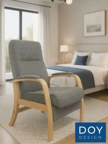 Grey cushioned chair with wooden frame in a bedroom.