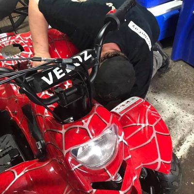 Chris Thibault fixing an ATV in his Garage at Vermont Small Engine in Essex Jct., VT.