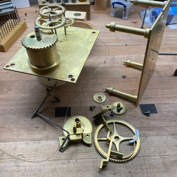 Time only (no chime) antique clock mechanism taken apart.