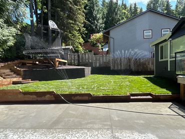 new grass installation , picture of the grass being watered after installation
