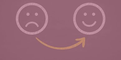 Arrow showing transformation from sad face to happy face on purple background.