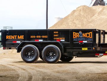Bumper-pull dump trailer for Bronco Junk Removal. Ready for tasks like concrete, dirt, and sod 
