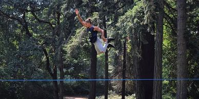 A professional slackliner doing a stunt