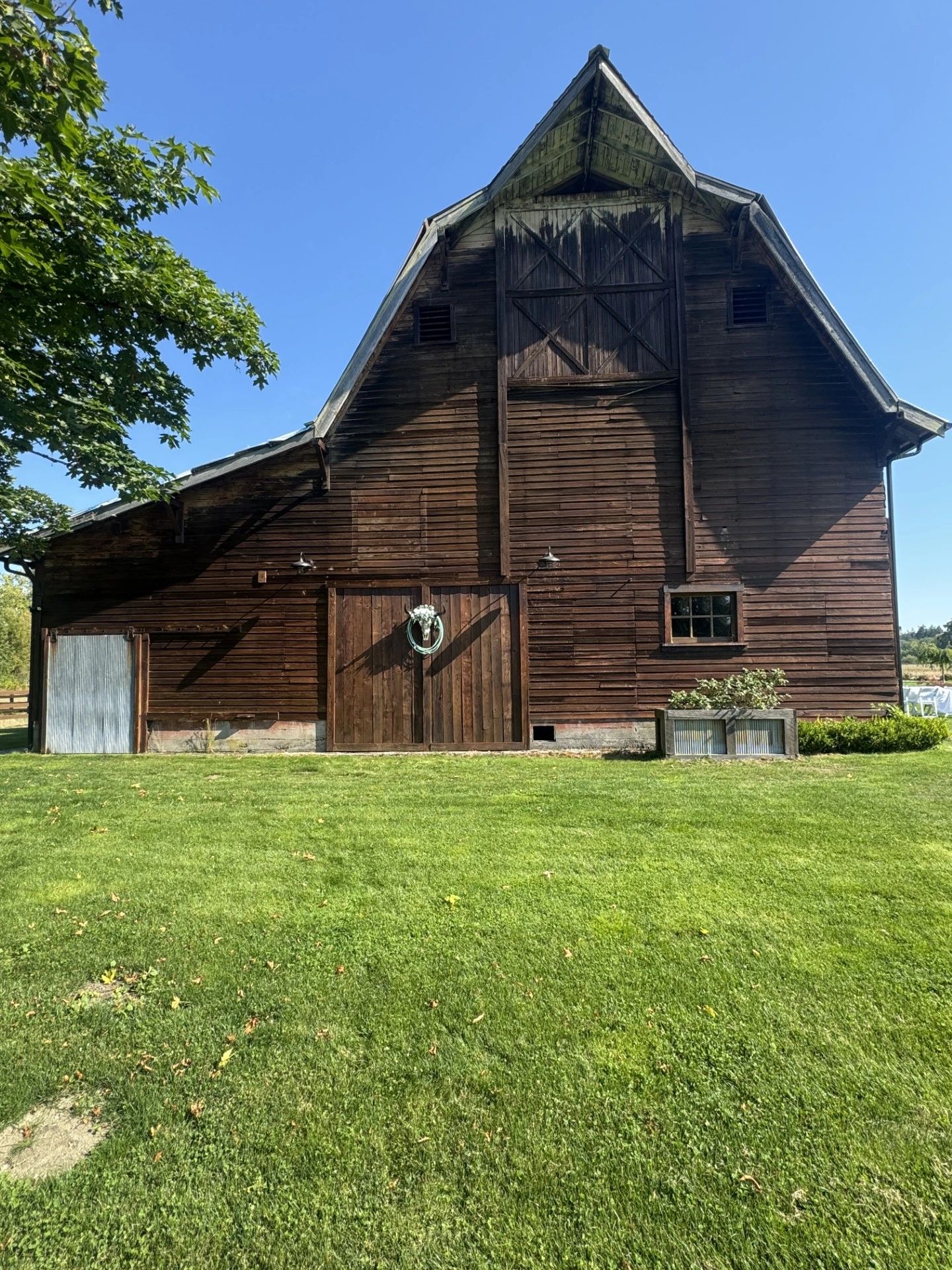 Rustic wooden barn on a sunny day.