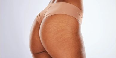 woman in tan underwear from behind waist to midthigh 