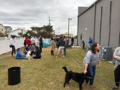 The grass backyard space that is dog friendly at the Crystal Coast Brewing taproom